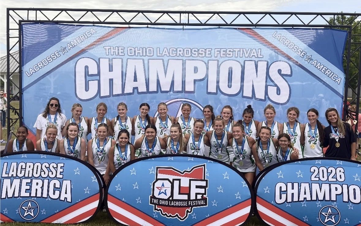 Dublin Lacrosse Club team with Ohio Lacrosse Festival champions banner